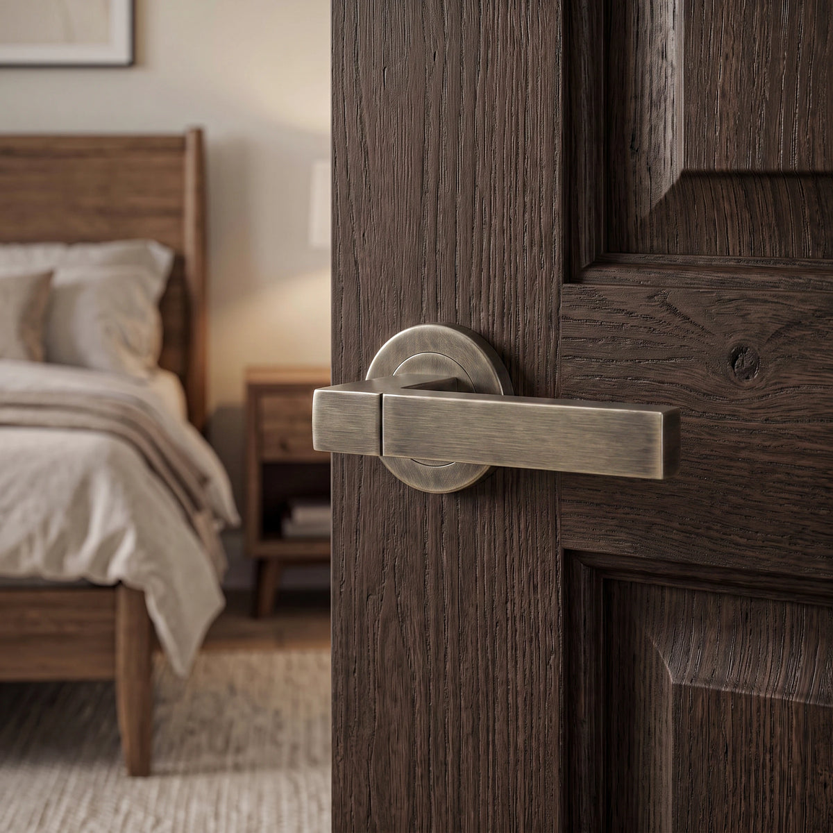 Lumina Antique Brass Door Lever Handles – fitted on an interior door in a styled room setting 3