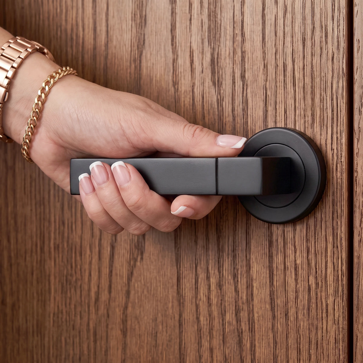 Lumina Matt Black Passage Door Lever Handles – held in hand to show the size and finish