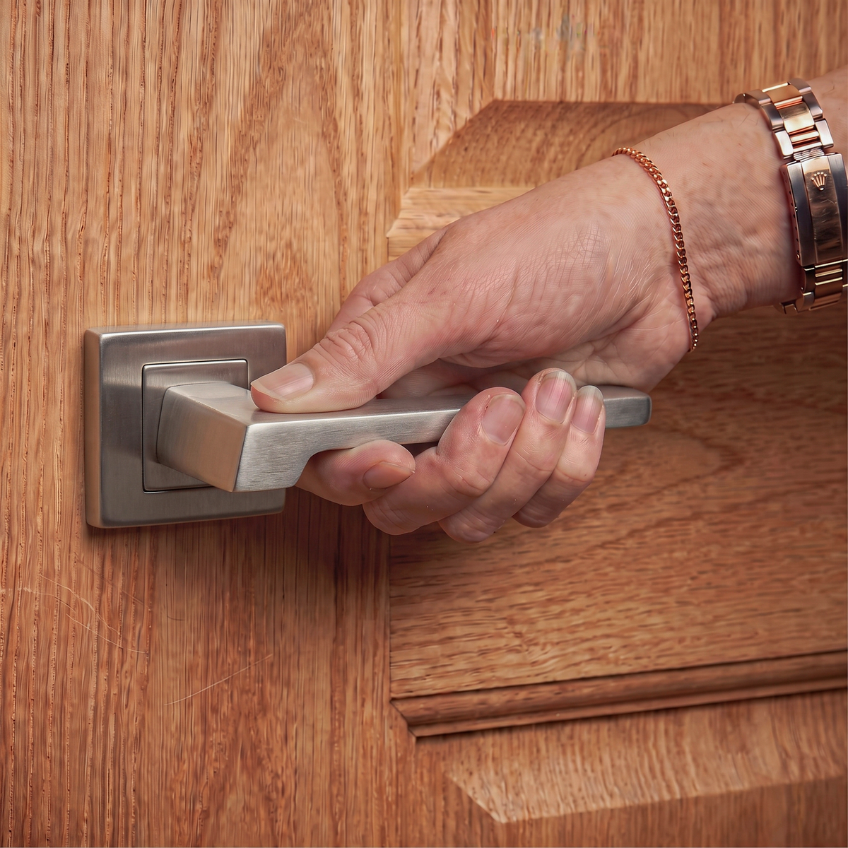 Spectra Satin Nickel Privacy Door Lever Handles – held in hand to show the size and finish