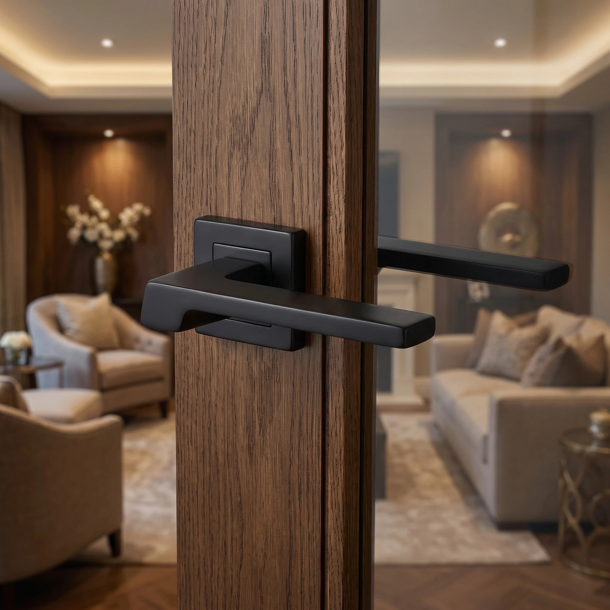 Spectra Matt Black Door Lever Handles – fitted on an interior door in a styled room setting 4