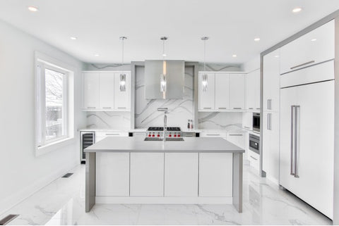 A kitchen with new, stainless steel handles