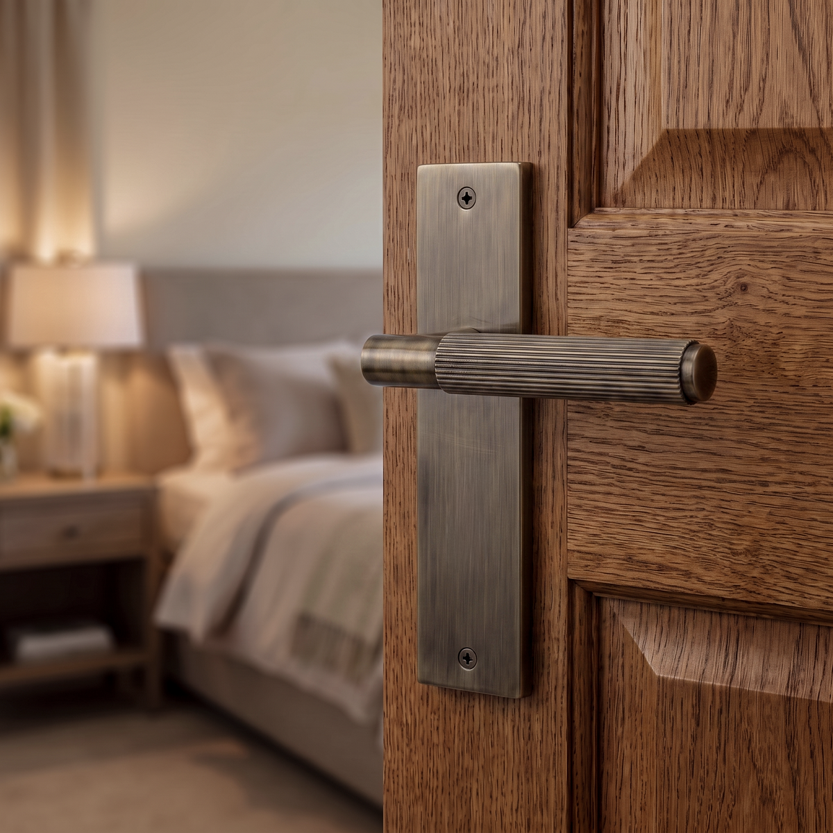 Hera Antique Brass Passage Door Lever Handles on Backplate – fitted on an interior door in a styled room setting 2