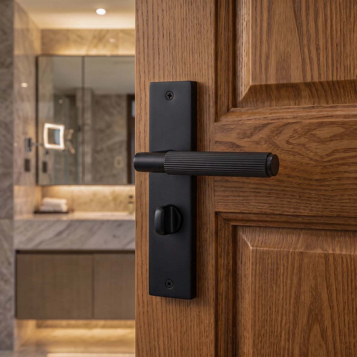 Hera Matt Black Door Lever Handles on Backplate – fitted on an interior door in a styled room setting 2