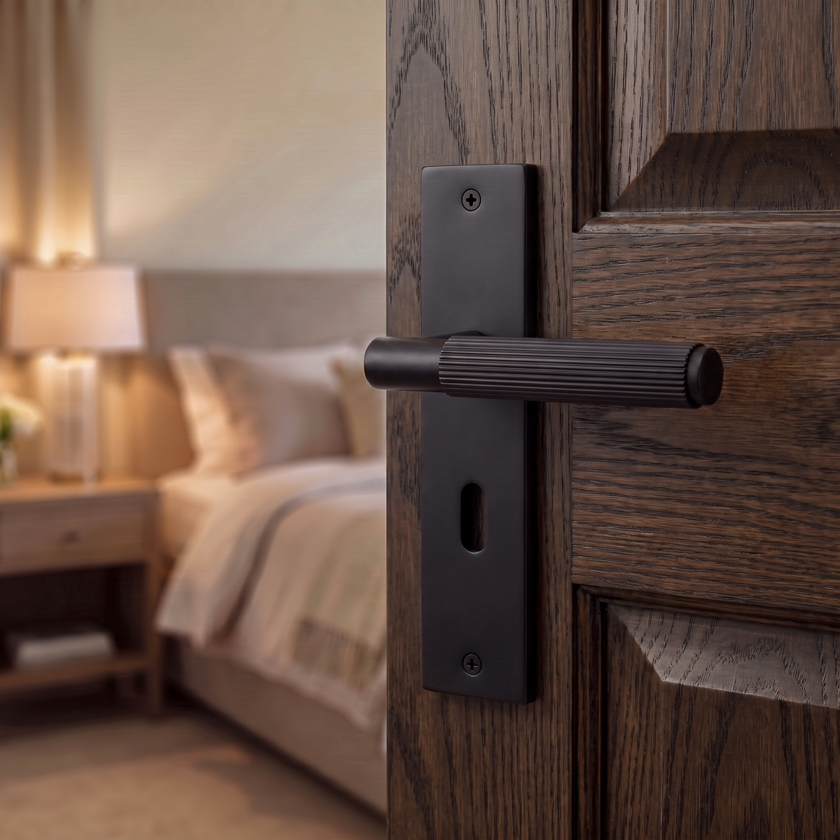 Hera Matt Black Privacy Door Lever Handles on Backplate – fitted on an interior door in a styled room setting 2