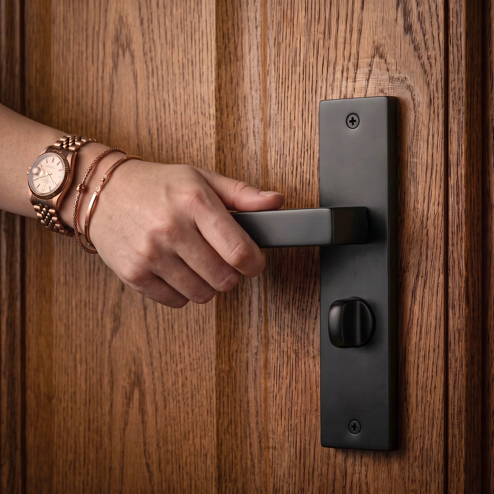 Lumina Matt Black Door Lever Handles on Backplate – held in hand to show the size and finish