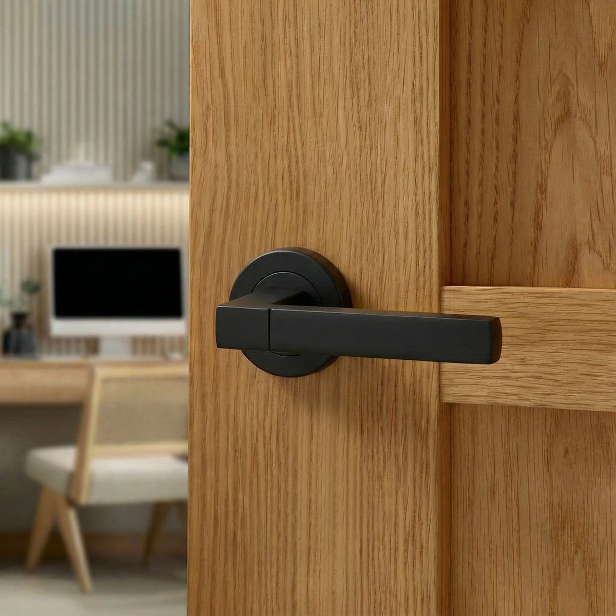 Lumina Matt Black Passage Door Lever Handles – fitted on an interior door in a styled room setting