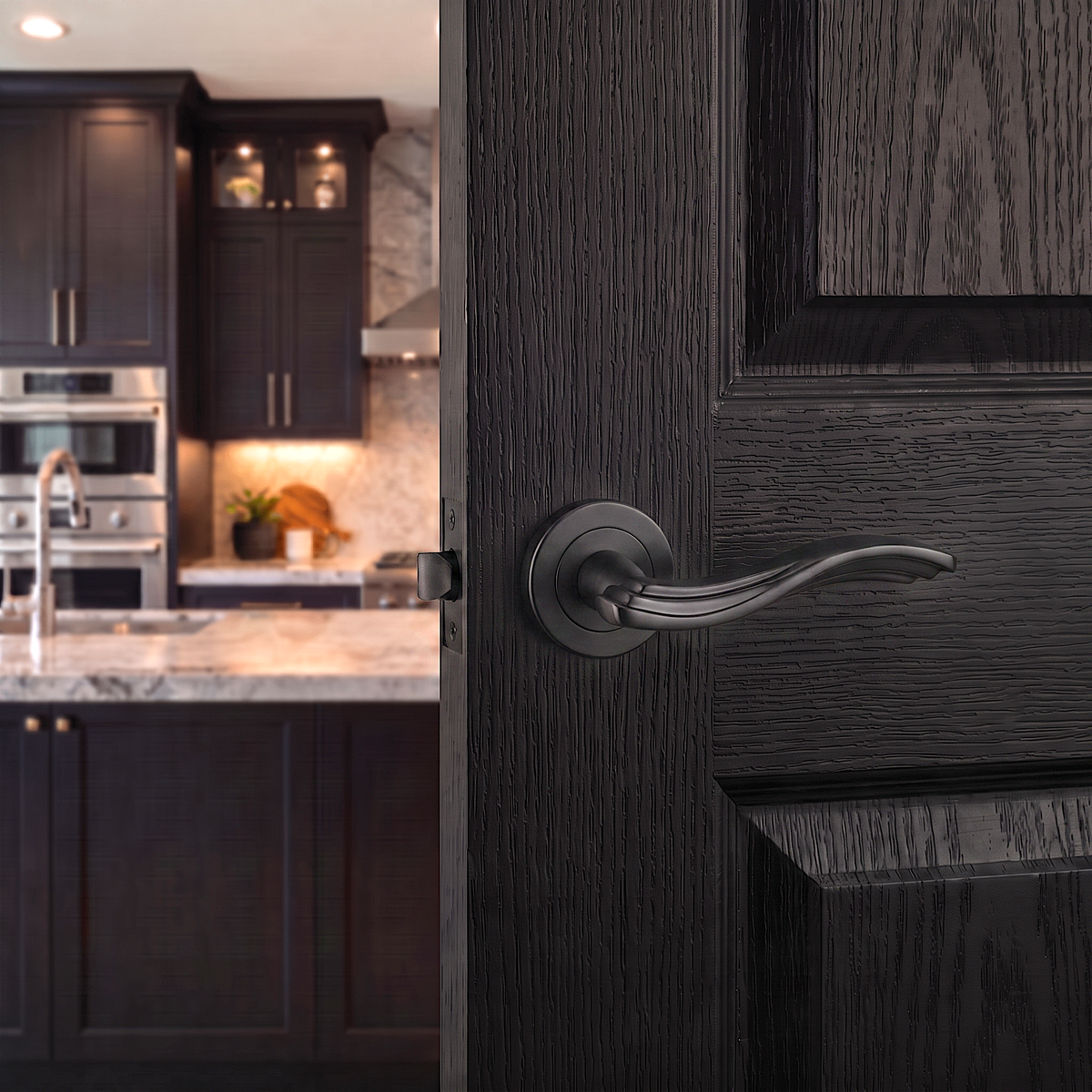 Solace Matt Black Privacy Door Lever Handles – fitted on an interior door in a styled room setting 2