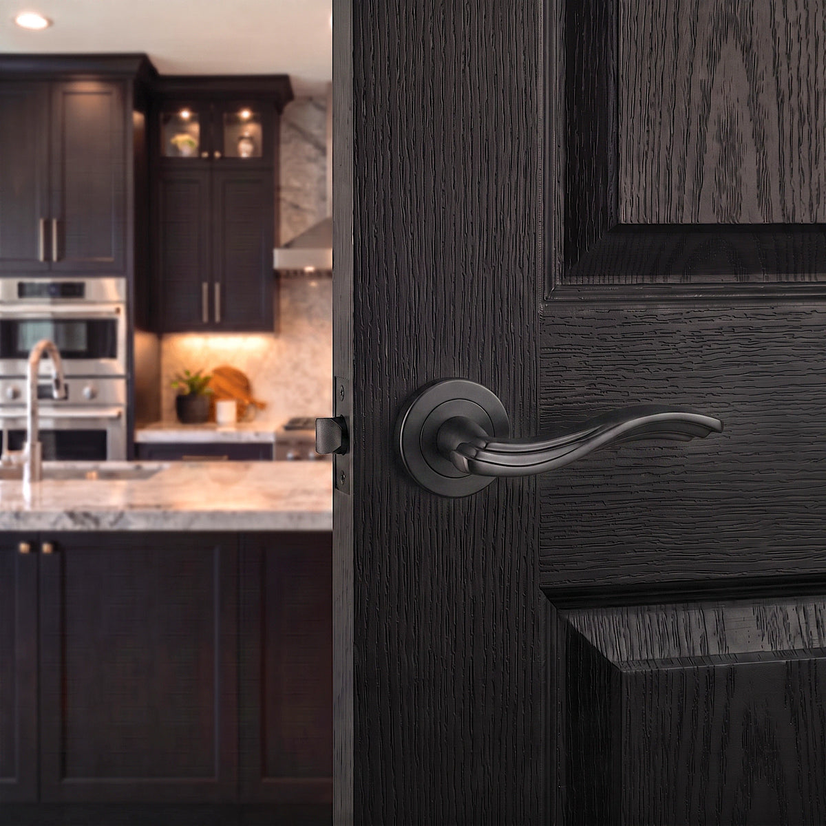 Solace Matt Black Passage Door Lever Handles – fitted on an interior door in a styled room setting 2