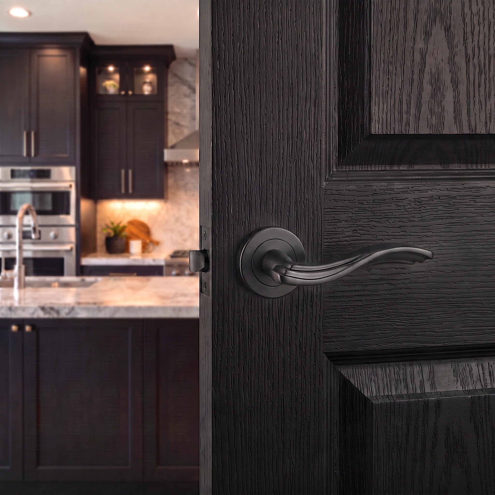 Solace Matt Black Passage Door Lever Handles – fitted on an interior door in a styled room setting 2