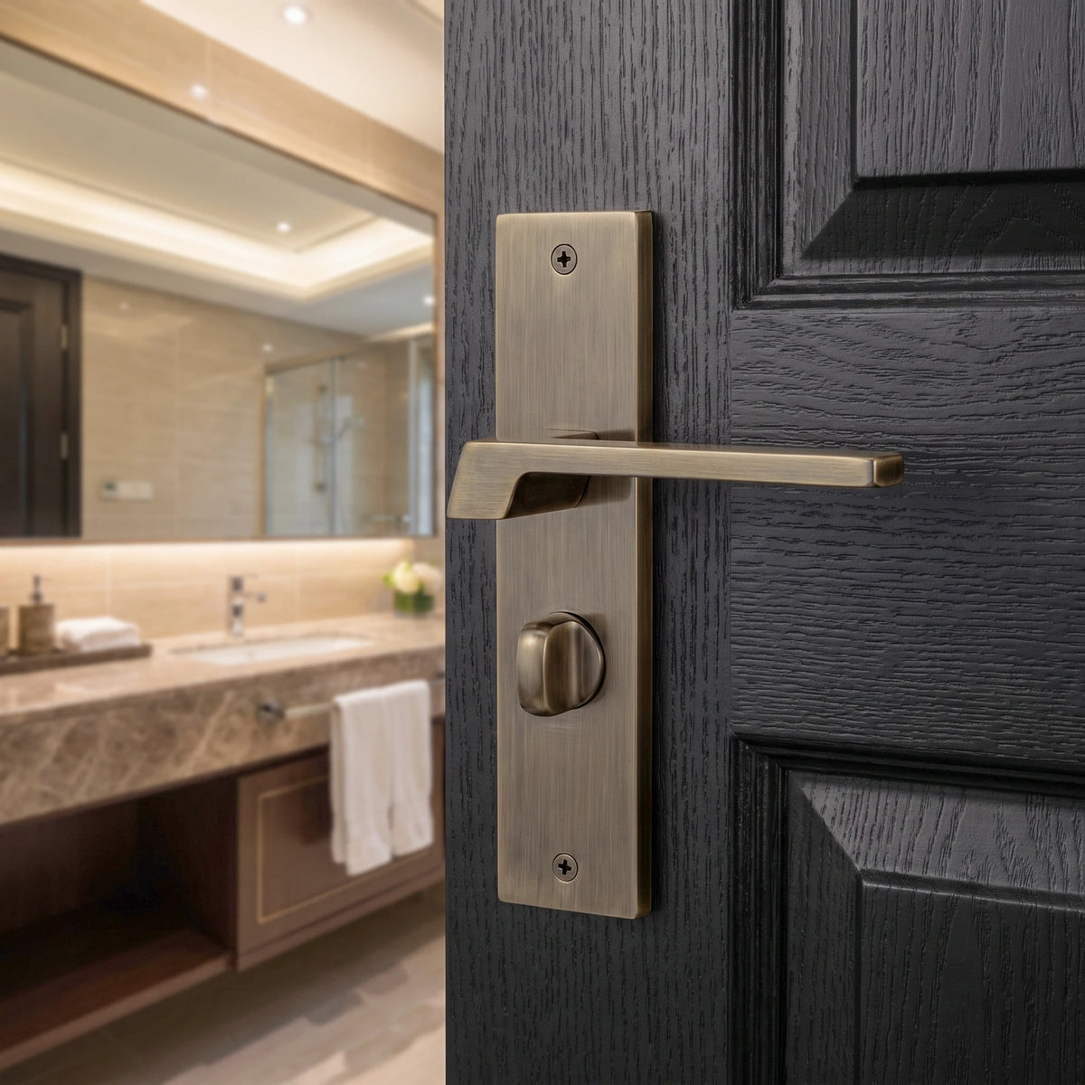 Spectra Antique Brass Door Lever Handles on Backplate – fitted on an interior door in a styled room setting 2
