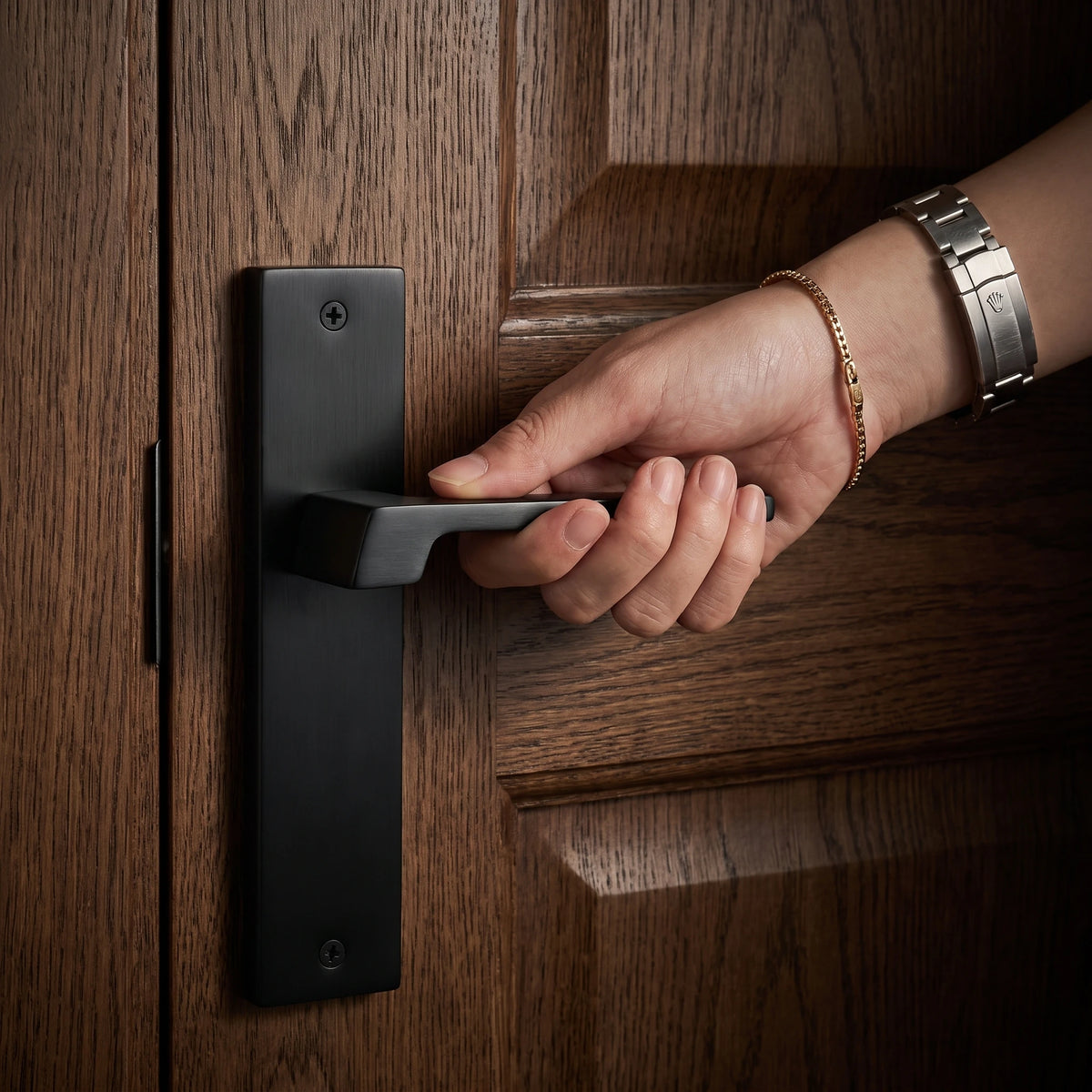 Spectra Door Handle on Backplate – held in hand to show the size and finish