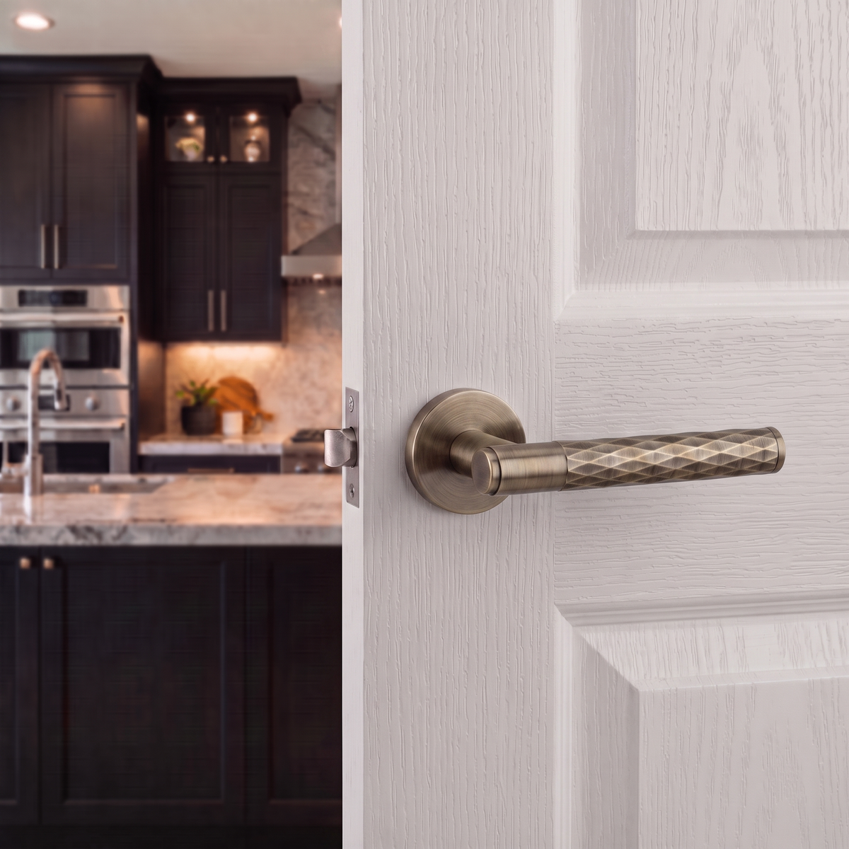 Tore Antique Brass Passage Door Lever Handles – fitted on an interior door in a styled room setting 4