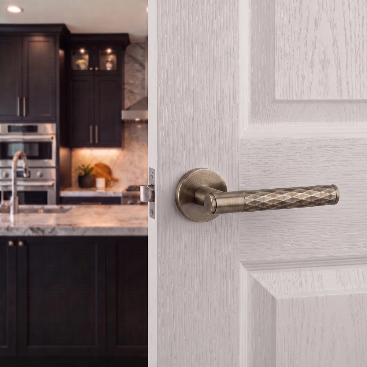 Tore Antique Brass Passage Door Handles – fitted on an interior door in a styled room setting 4