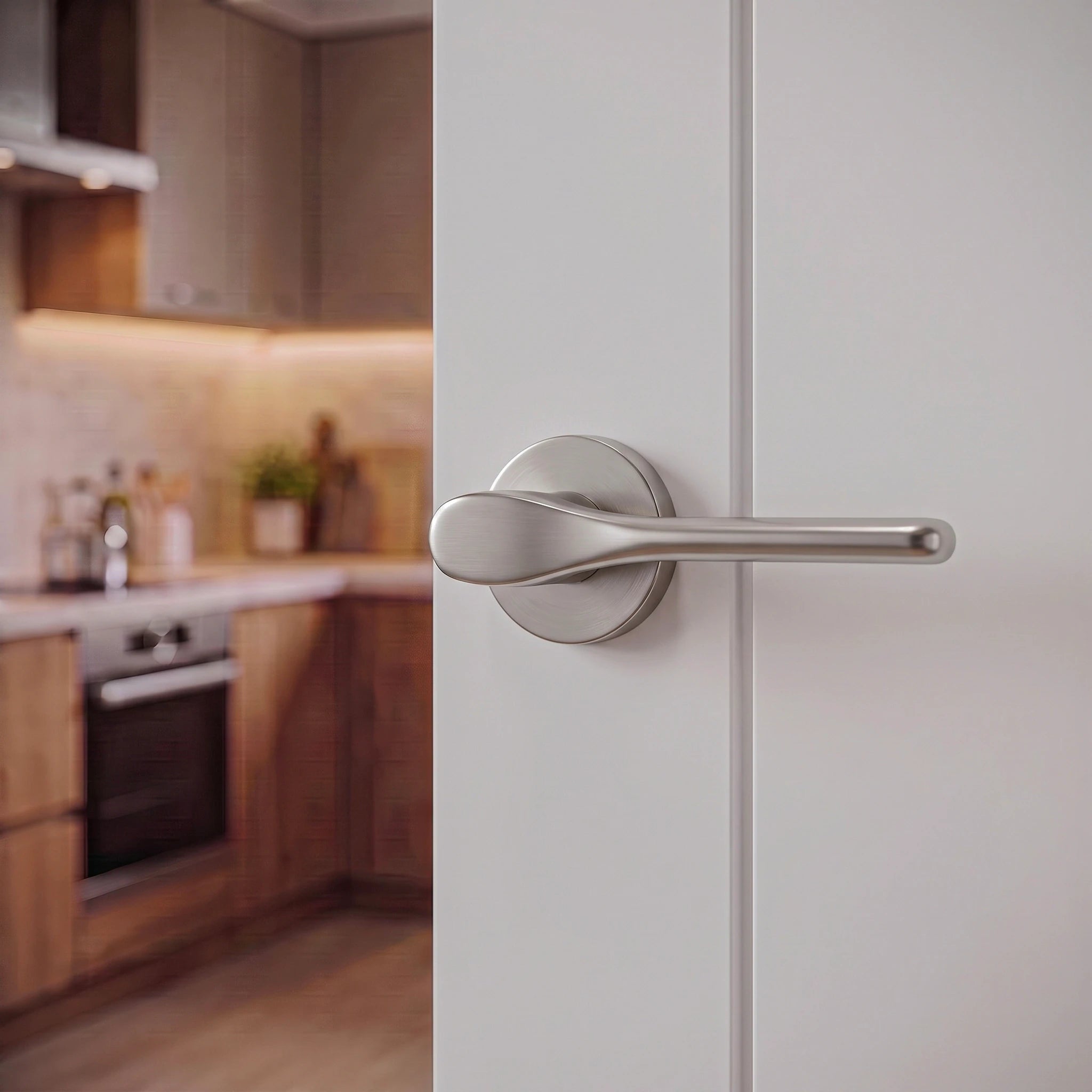 Verita Satin Nickel Privacy Door Handles – fitted on an interior door in a styled room setting 3