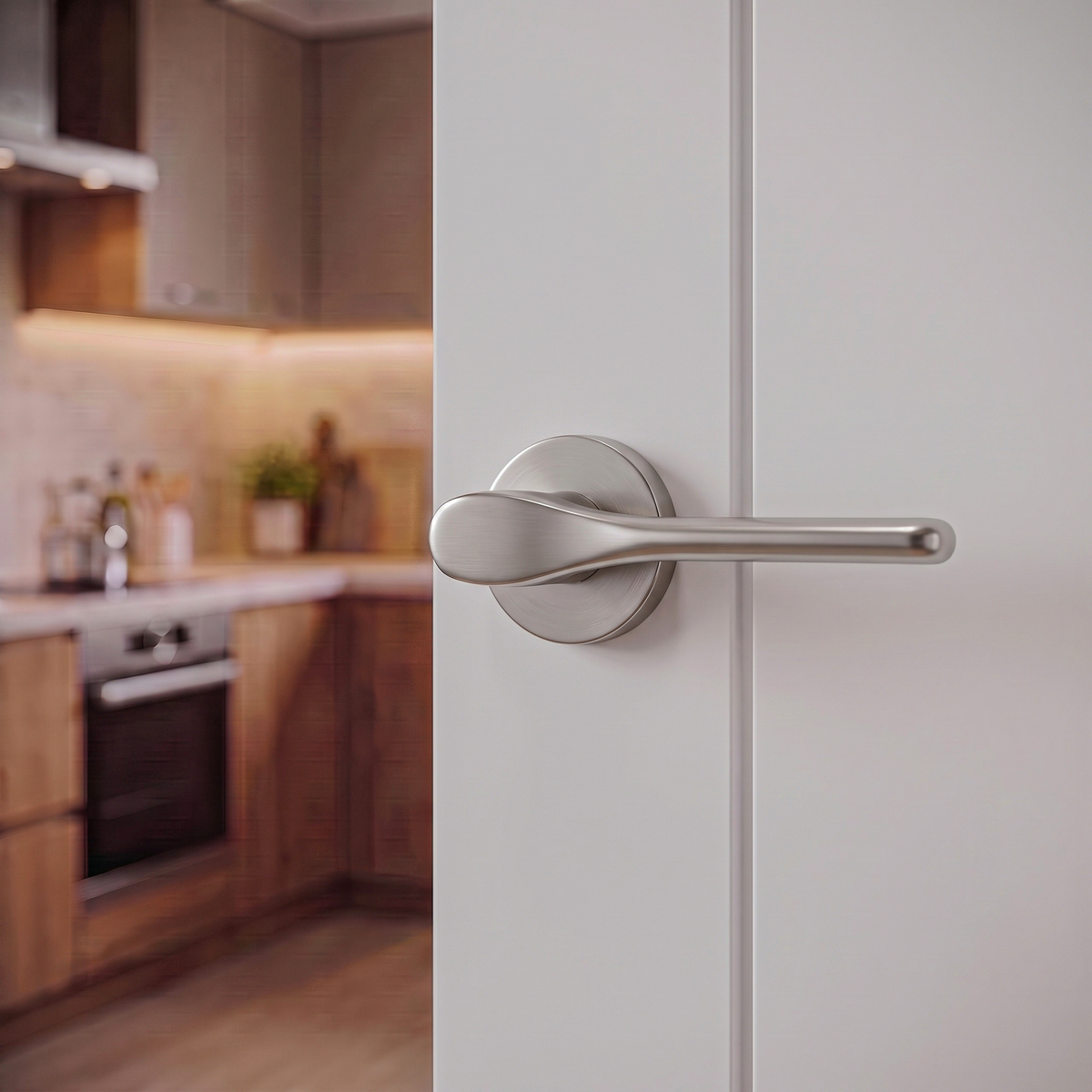 Verita Satin Nickel Privacy Door Lever Handles – fitted on an interior door in a styled room setting 3